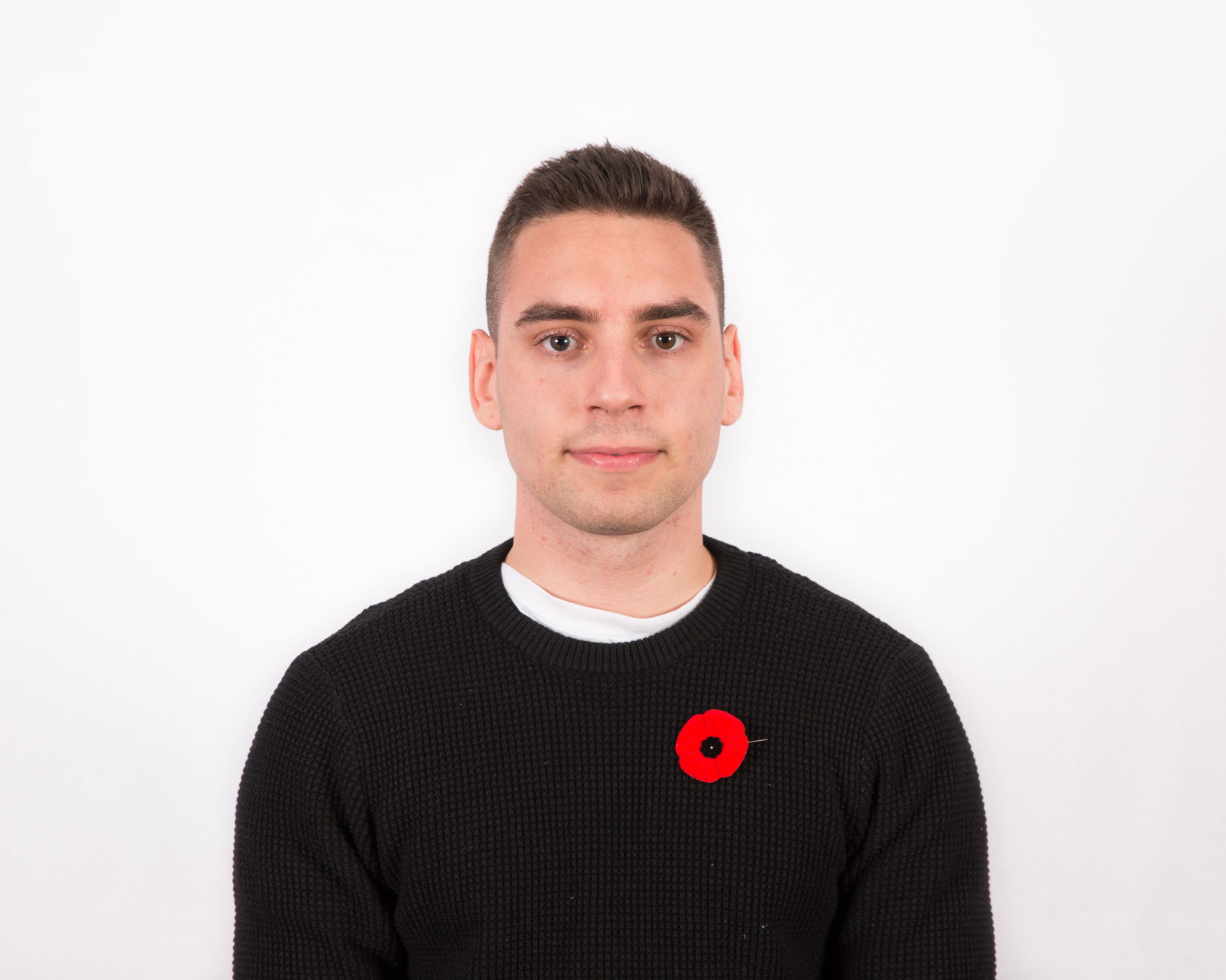 Carmen Mallia headshot with poppy (Photo)